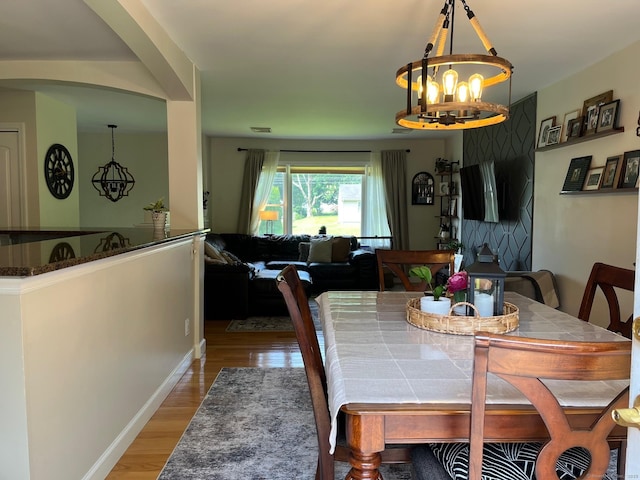 15 Great Meadow Rd, Danbury, CT 06811 - dining room with wood finished floors, a chandelier, and arched walkways