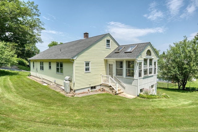 135 Jackson St, Torrington, CT 06790 - back of house with a shingled roof, a chimney, and a yard