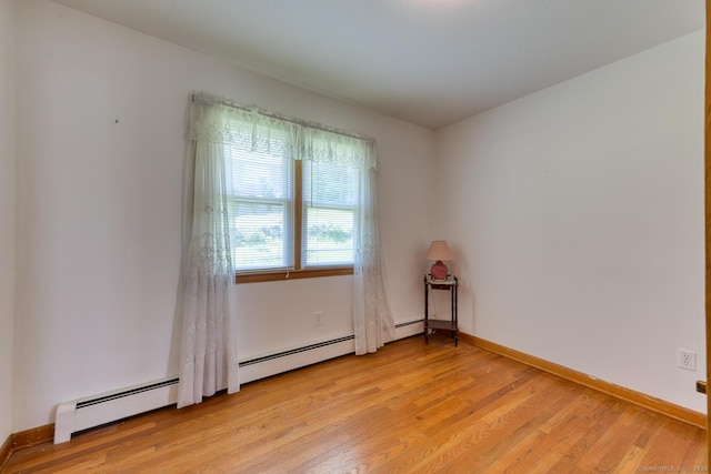 135 Jackson St, Torrington, CT 06790 - unfurnished room featuring light wood-style flooring and a baseboard radiator