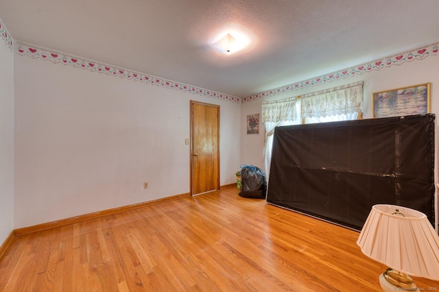 135 Jackson St, Torrington, CT 06790 - empty room featuring wood finished floors and a textured ceiling