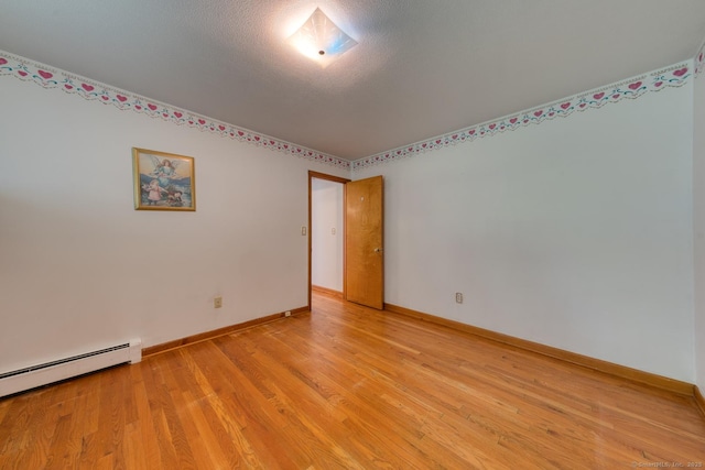 135 Jackson St, Torrington, CT 06790 - spare room featuring baseboard heating and light wood-style floors