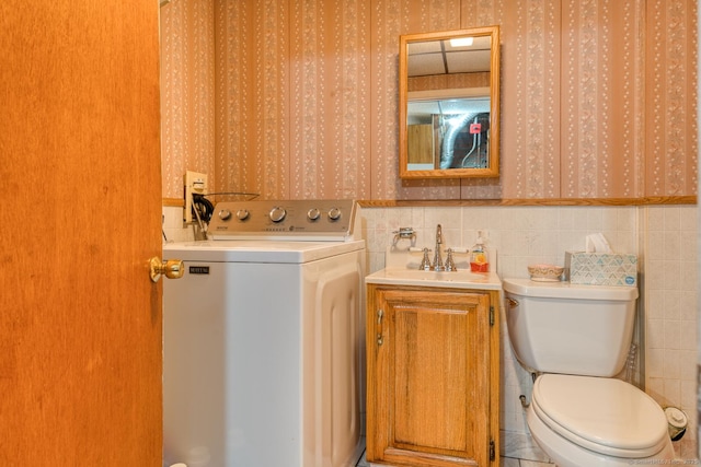 135 Jackson St, Torrington, CT 06790 - bathroom featuring washer / dryer, wallpapered walls, and vanity