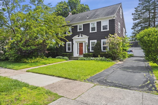 30 Cleveland Rd, New Haven, CT 06515 - colonial home featuring a front yard, a chimney, and roof with shingles