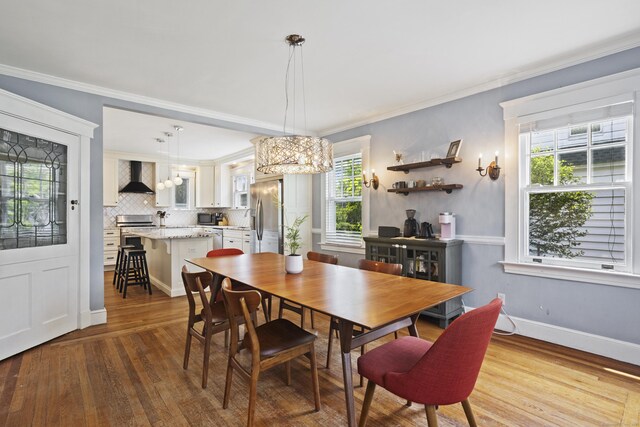 30 Cleveland Rd, New Haven, CT 06515 - dining room with a chandelier, wood finished floors, and crown molding