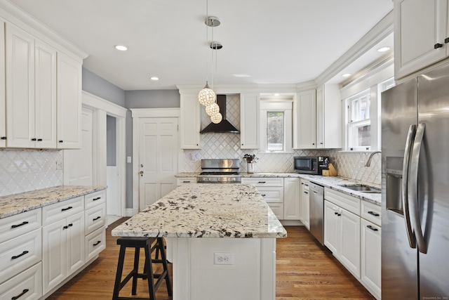 30 Cleveland Rd, New Haven, CT 06515 - kitchen with stainless steel appliances, wall chimney exhaust hood, tasteful backsplash, white cabinetry, and wood finished floors