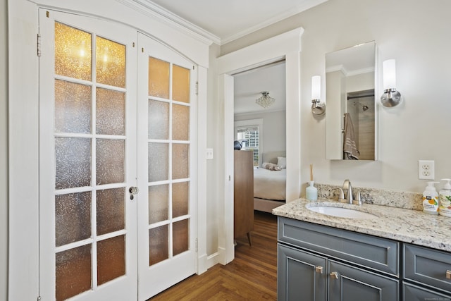 30 Cleveland Rd, New Haven, CT 06515 - bathroom featuring crown molding, vanity, french doors, parquet flooring, and ensuite bath