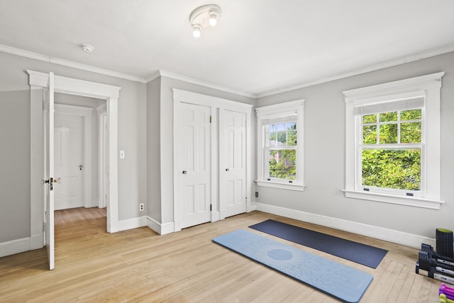 30 Cleveland Rd, New Haven, CT 06515 - workout area with light wood-style flooring and crown molding