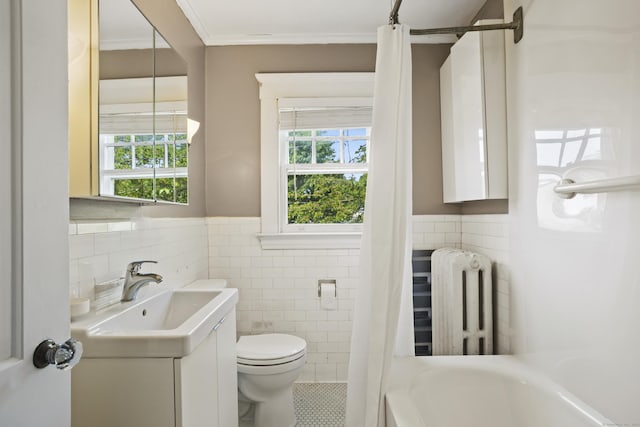 30 Cleveland Rd, New Haven, CT 06515 - full bath with radiator, tile walls, a tub to relax in, vanity, and plenty of natural light