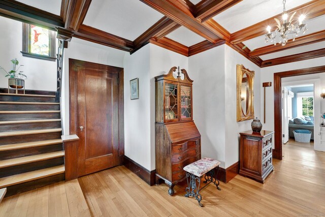 20 Arnoldale Rd, West Hartford, CT 06119 - foyer entrance with light wood-type flooring, a chandelier, baseboards, coffered ceiling, and stairs