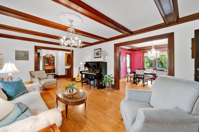 20 Arnoldale Rd, West Hartford, CT 06119 - living room featuring a chandelier, light wood-style floors, ornamental molding, beamed ceiling, and baseboards