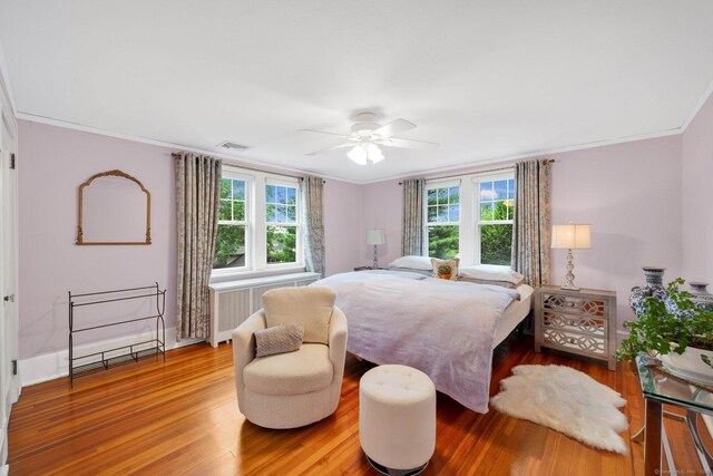 20 Arnoldale Rd, West Hartford, CT 06119 - bedroom with wood finished floors, multiple windows, crown molding, ceiling fan, and baseboards