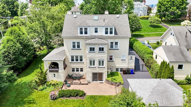 20 Arnoldale Rd, West Hartford, CT 06119 - rear view of property featuring stucco siding, a patio area, a chimney, and a gate