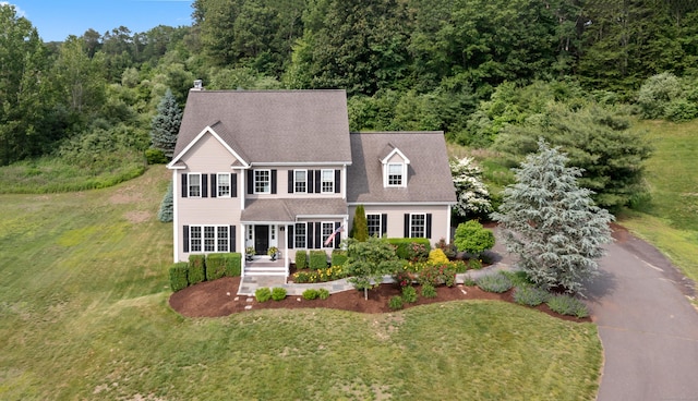 11 Quarry Ridge Rd, Newtown, CT 06482 - colonial house featuring a front lawn, a forest view, and roof with shingles