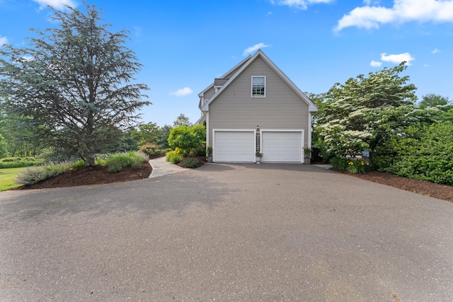 11 Quarry Ridge Rd, Newtown, CT 06482 - view of side of home with a garage and driveway