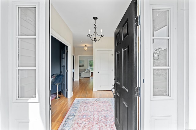 11 Quarry Ridge Rd, Newtown, CT 06482 - entryway with light wood finished floors and a chandelier