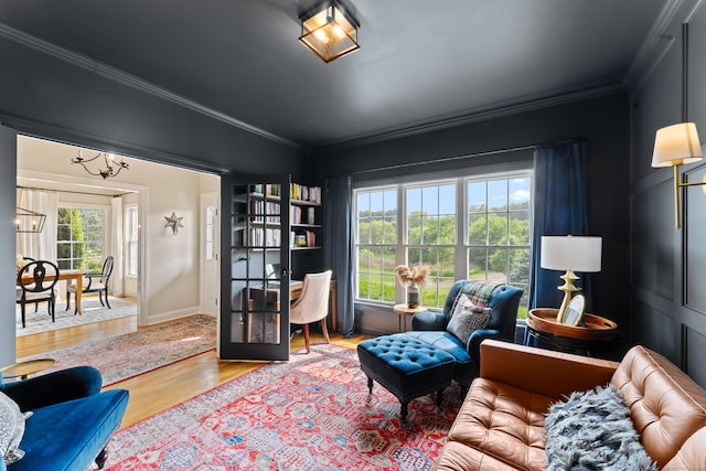 11 Quarry Ridge Rd, Newtown, CT 06482 - living room with ornamental molding, wood finished floors, and a chandelier