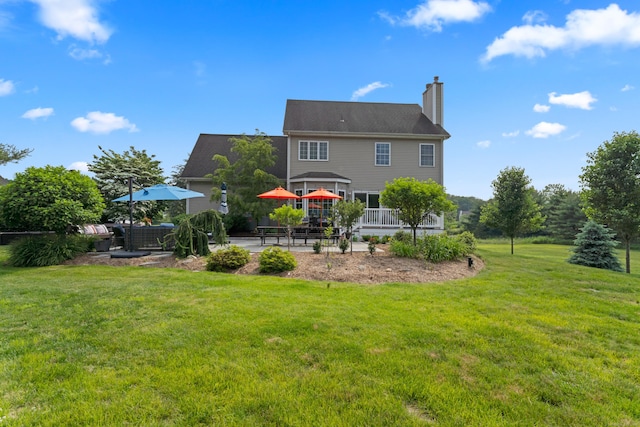 11 Quarry Ridge Rd, Newtown, CT 06482 - rear view of property with a patio, a chimney, and a yard