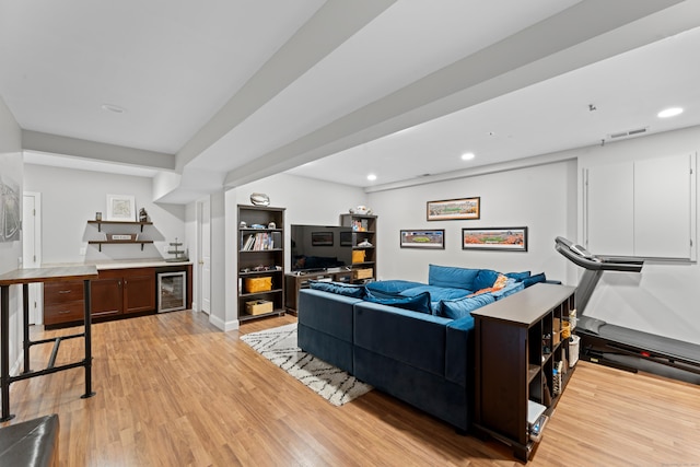 11 Quarry Ridge Rd, Newtown, CT 06482 - living room with wine cooler, wet bar, light wood-type flooring, and recessed lighting