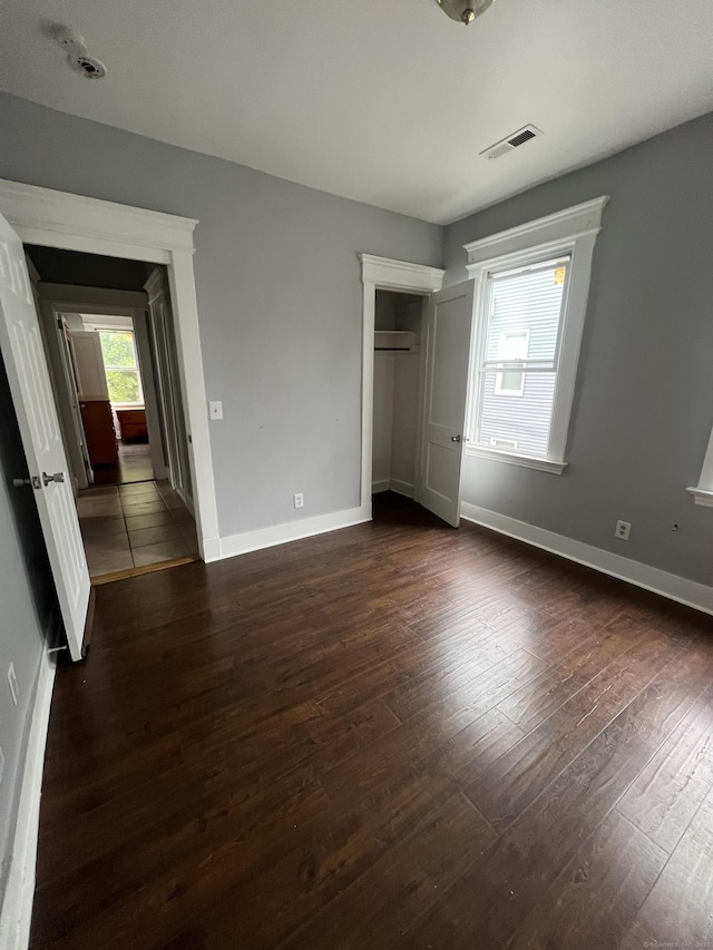 87 Blake St, New Haven, CT 06511 - unfurnished bedroom featuring dark wood-style flooring and a closet
