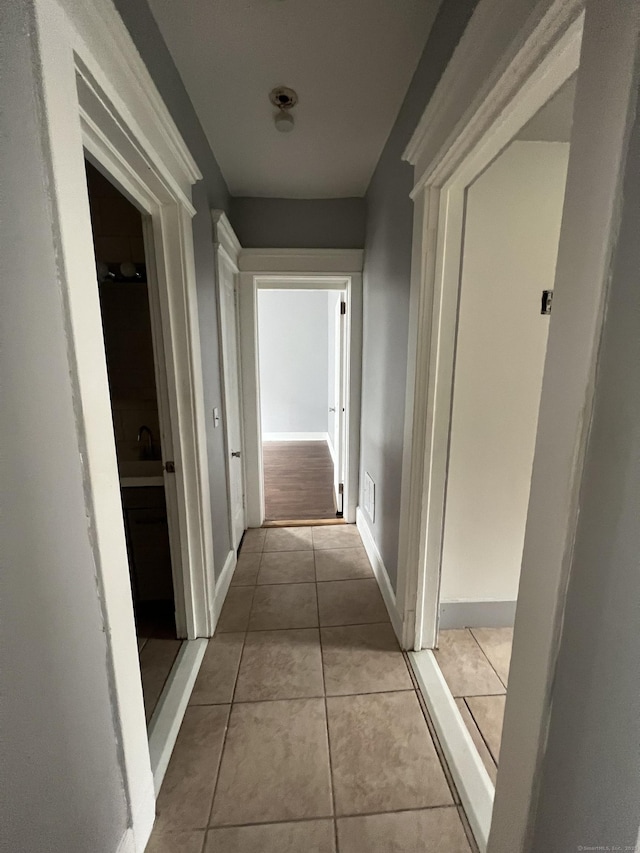 87 Blake St, New Haven, CT 06511 - hallway featuring tile patterned floors and baseboards