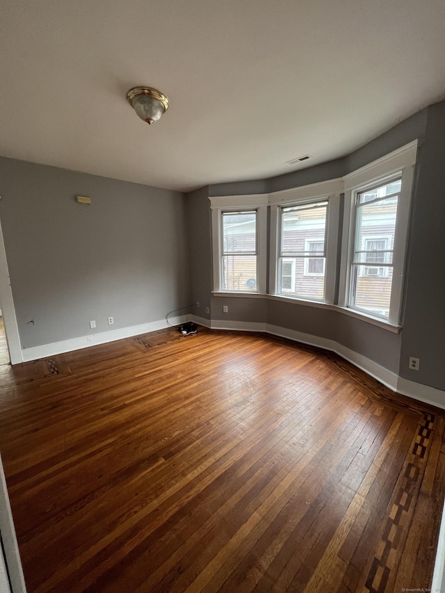 87 Blake St, New Haven, CT 06511 - spare room featuring dark wood-style floors and baseboards