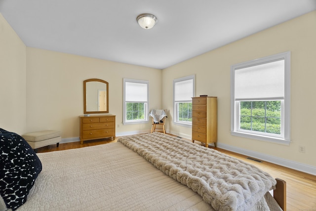 102 Leetes Island Rd, Guilford, CT 06437 - bedroom featuring baseboards and wood finished floors