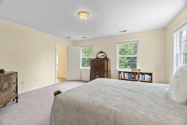 102 Leetes Island Rd, Guilford, CT 06437 - carpeted bedroom featuring baseboards and multiple windows