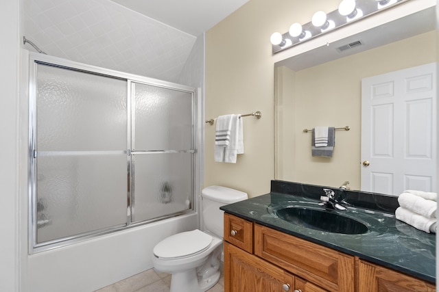 102 Leetes Island Rd, Guilford, CT 06437 - bathroom with vanity, tile patterned flooring, combined bath / shower with glass door, and toilet