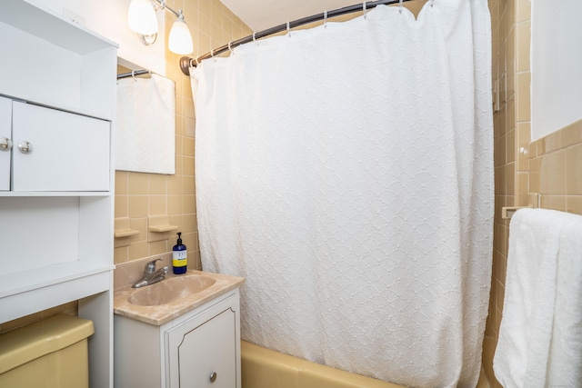 159 Cambridge Dr, East Hartford, CT 06118 - bathroom featuring tile walls, vanity, shower / bath combo with shower curtain, and toilet