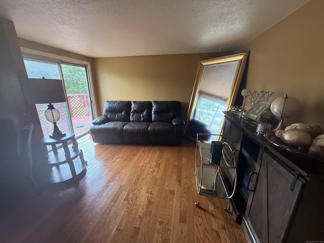 6 Sandra Dr, Bloomfield, CT 06002 - living area featuring a textured ceiling and light wood-type flooring