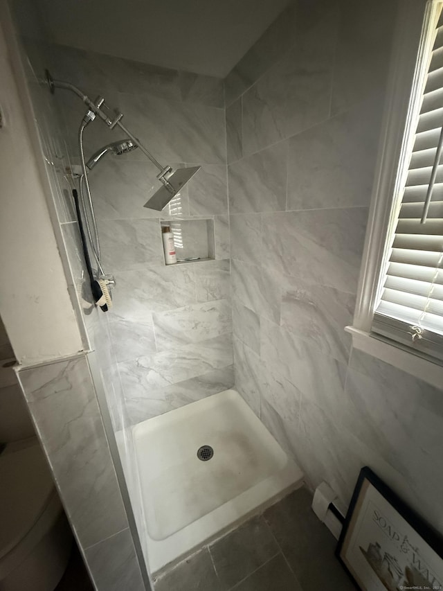 6 Sandra Dr, Bloomfield, CT 06002 - full bathroom featuring a tile shower, toilet, and tile patterned flooring