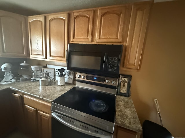 6 Sandra Dr, Bloomfield, CT 06002 - kitchen with black microwave and stainless steel range with electric cooktop