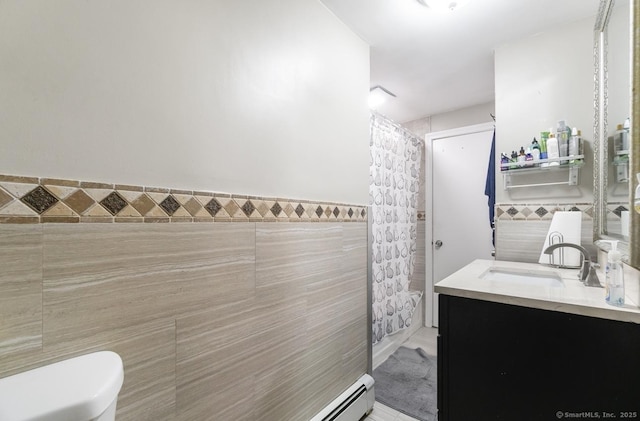 full bath with tile walls and vanity