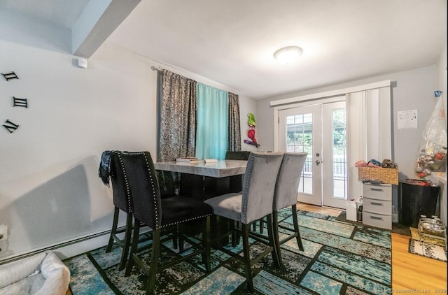 dining room featuring french doors and wood finished floors