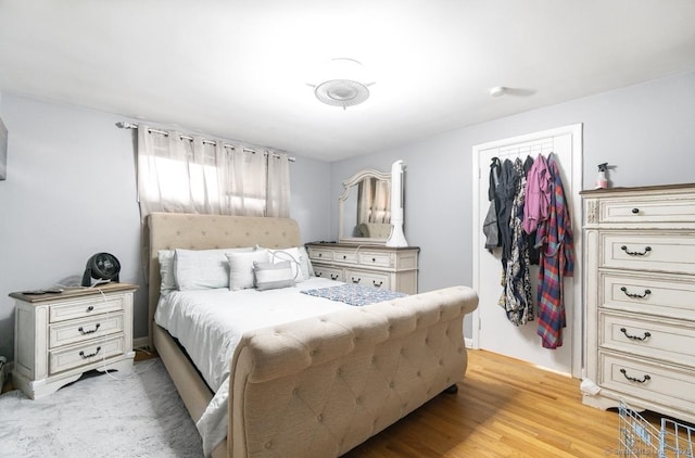bedroom with a closet and light wood-style floors