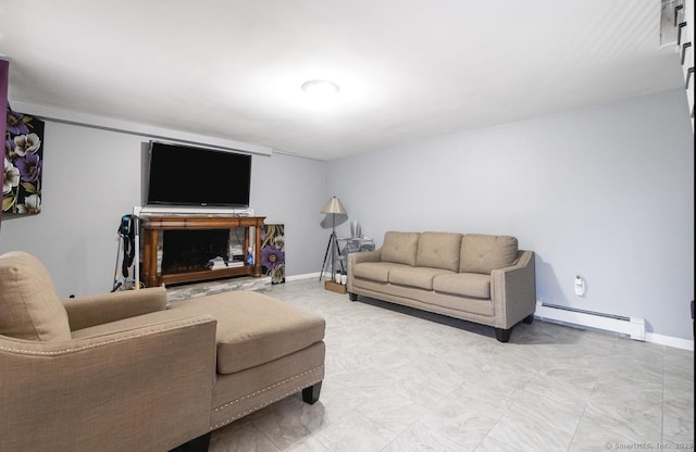 living area featuring a baseboard radiator and baseboards