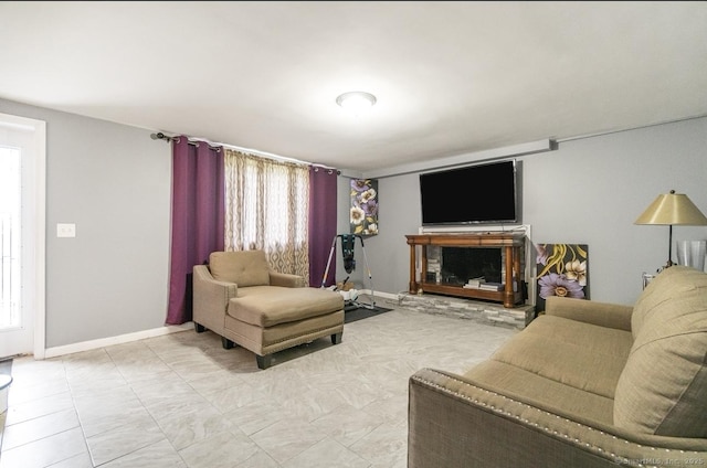 living room featuring baseboards