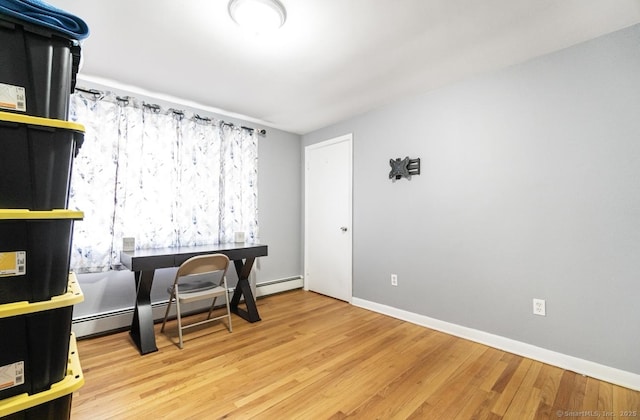 office with wood finished floors and baseboards