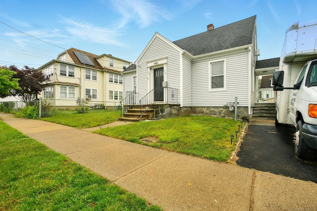 239 Graham St, Stratford, CT 06615 - view of front of property with a chimney and roof with shingles