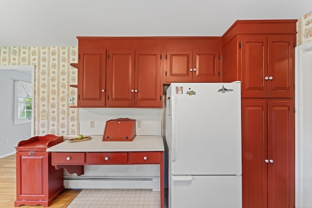 128 Walnut Tree Hill Rd, Newtown, CT 06482 - kitchen featuring freestanding refrigerator, baseboard heating, and light countertops