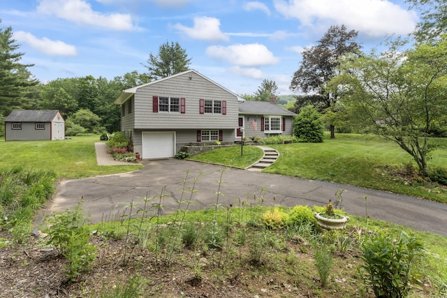 128 Walnut Tree Hill Rd, Newtown, CT 06482 - tri-level home featuring asphalt driveway, a garage, a front yard, and an outdoor structure