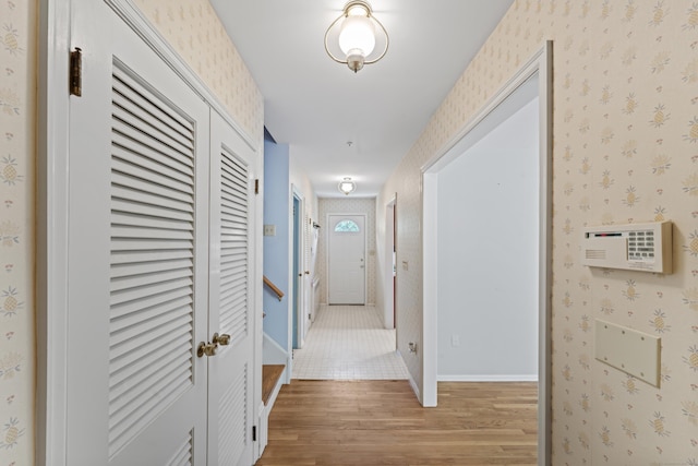 128 Walnut Tree Hill Rd, Newtown, CT 06482 - hallway with light wood-style floors and wallpapered walls