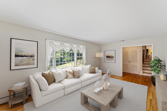128 Walnut Tree Hill Rd, Newtown, CT 06482 - living room featuring a baseboard heating unit and wood finished floors