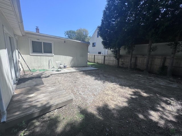 61 Naubuc Ave, East Hartford, CT 06118 - fenced backyard featuring a deck