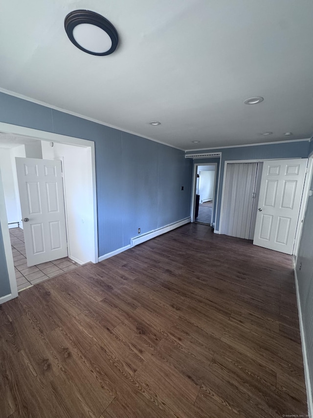61 Naubuc Ave, East Hartford, CT 06118 - unfurnished bedroom featuring a baseboard radiator, ornamental molding, dark wood-style flooring, and baseboards