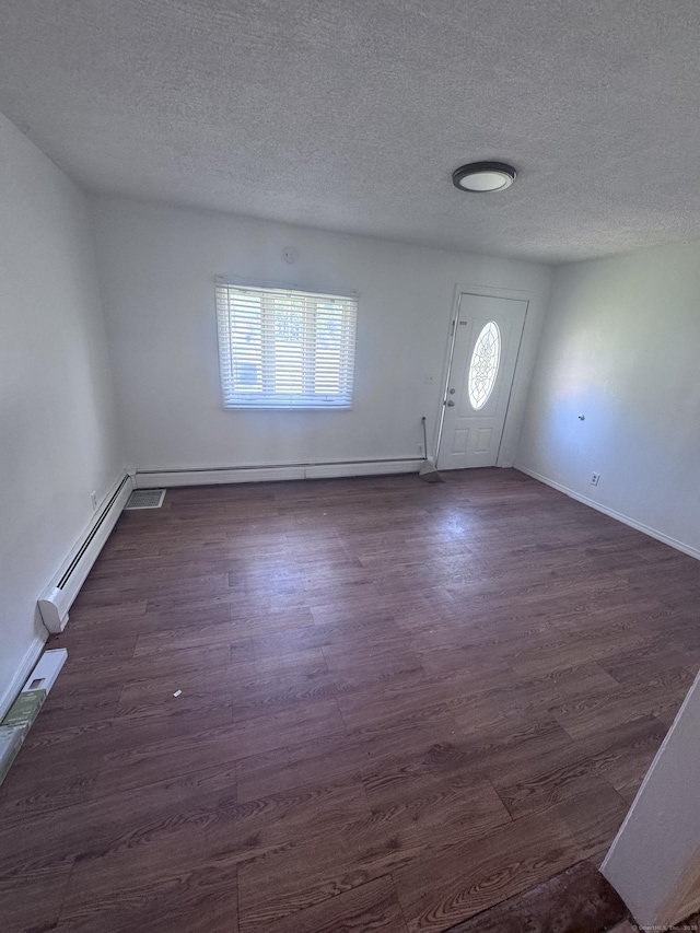 61 Naubuc Ave, East Hartford, CT 06118 - foyer featuring a baseboard radiator, a textured ceiling, dark wood-style floors, and baseboards