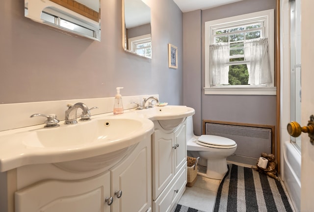 46 Dyer Ave, Canton, CT 06019 - full bathroom featuring radiator, double vanity, healthy amount of natural light, and tile patterned floors