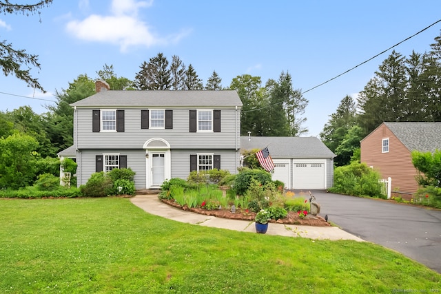 46 Dyer Ave, Canton, CT 06019 - colonial home with a chimney, a front yard, and a detached garage