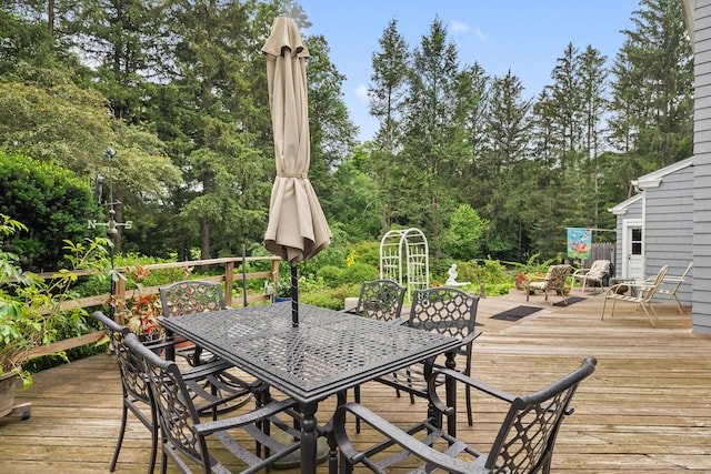 46 Dyer Ave, Canton, CT 06019 - wooden deck featuring outdoor dining area and view of wooded area