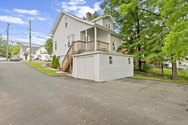 471 New Britain Rd, Berlin, CT 06037 - view of side of home with stairs and a chimney